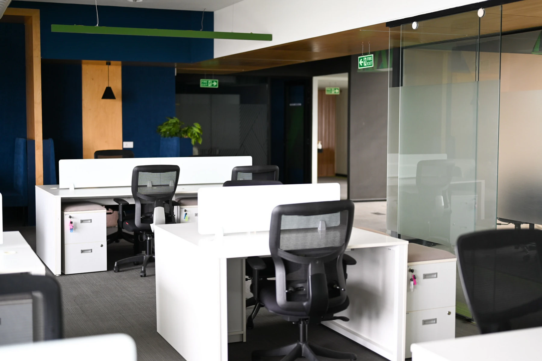 A quiet office floor with desks and locked cabinets in Bengaluru